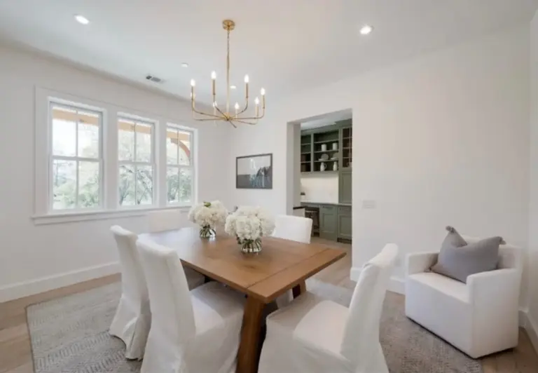 Dining room with a brass chandelier